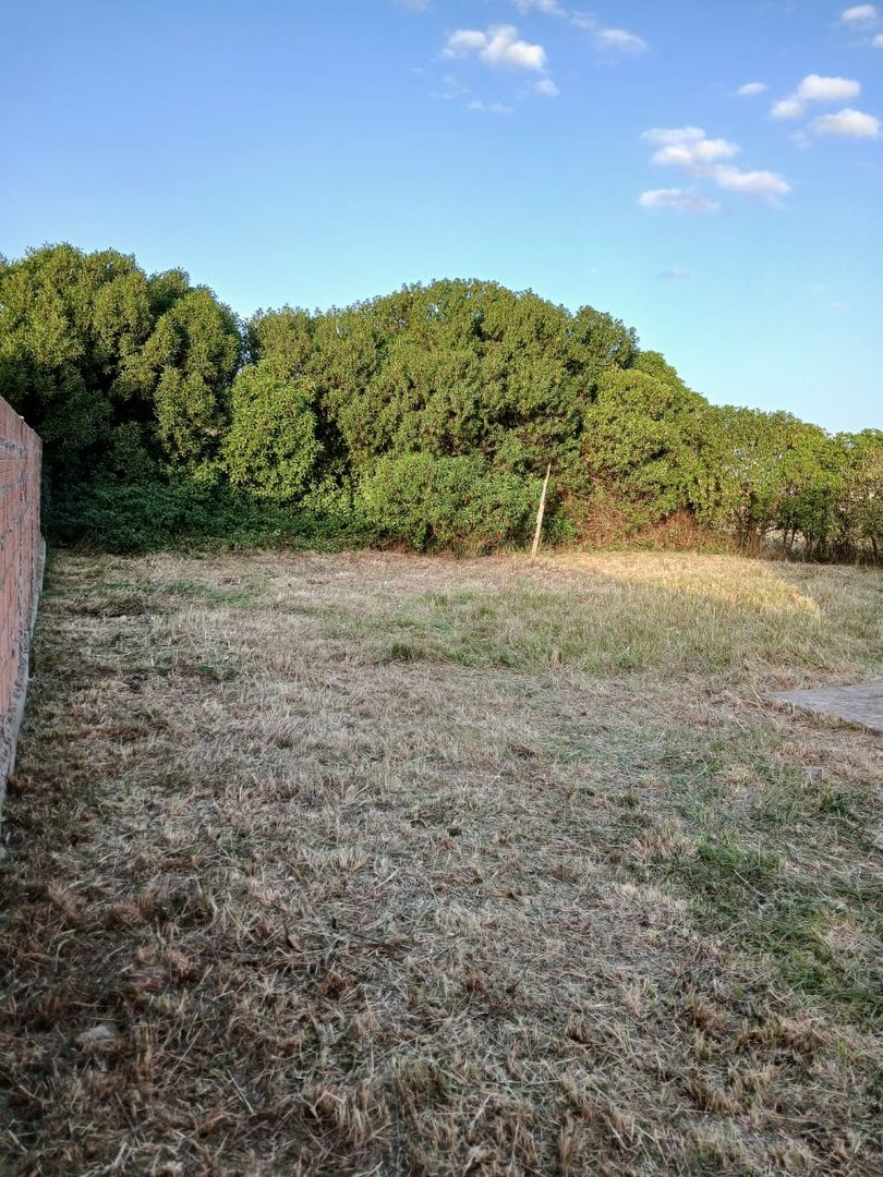 LOTE CON CONSTRUCCION A TERMINAR EN ATLANTIDA - Imagen 6